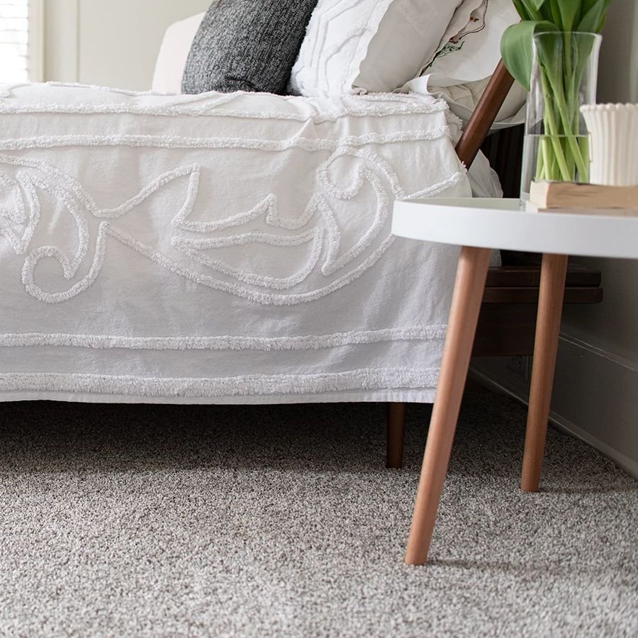 bed and coffee table on carpet - Andersons New Carpet Design in Fridley