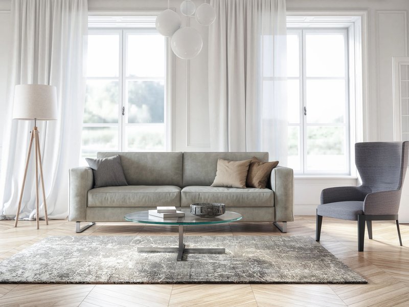 Couch and armchair on rug - Anderson's New Carpet Design in Fridley